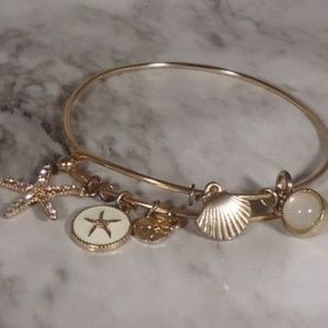 Gold tone beach themed charm bracelet